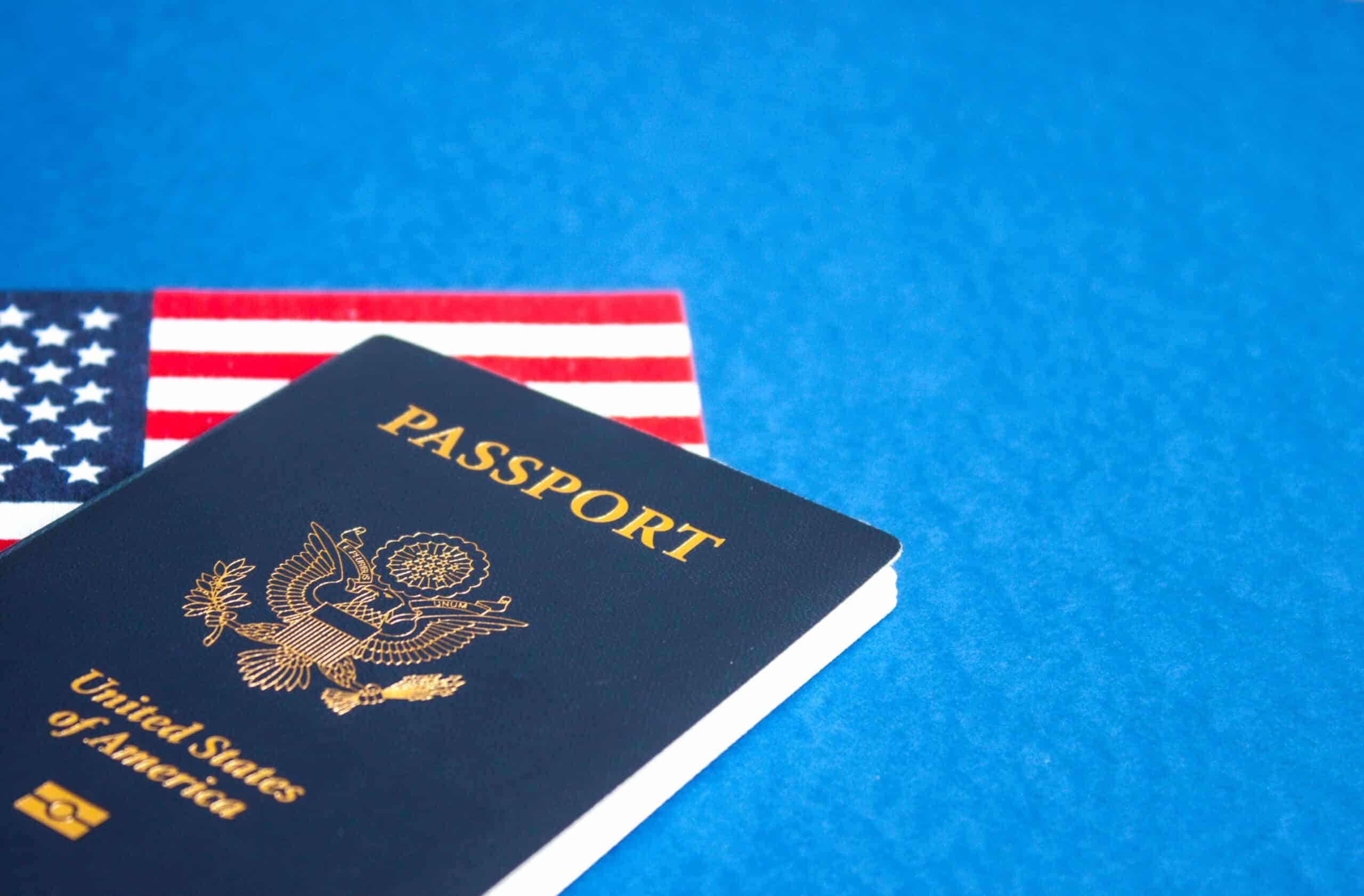 United States passport over an American flag.